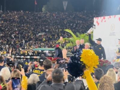 Head coach Jim Harbaugh of the Michigan Wolverines celebrates with The Leishman Trophy after beating the Alabama Crimson Tide 27-20 in overtime to win the CFP Semifinal Rose Bowl Game at Rose Bowl Stadium on January