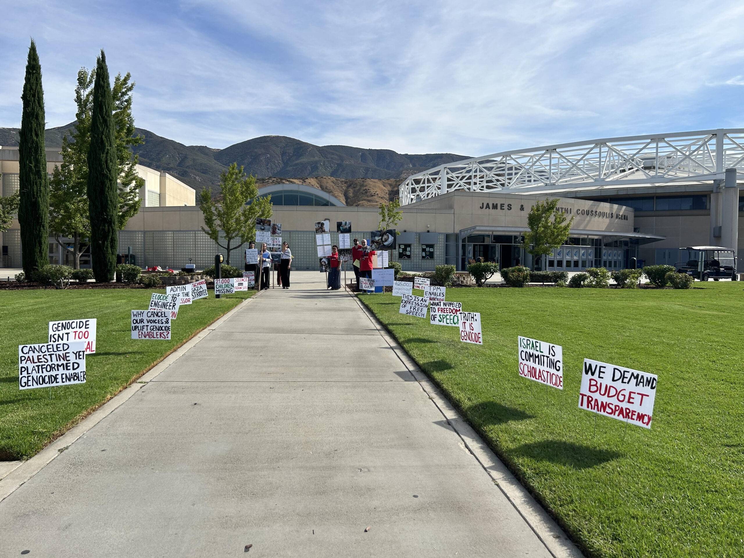 Faculty for Justice in Palestine (FJP) members set up signs and gathered outside of the Coussoulis Arena on Aug. 21 / Photo By Aldon Stiles, Inland Valley News